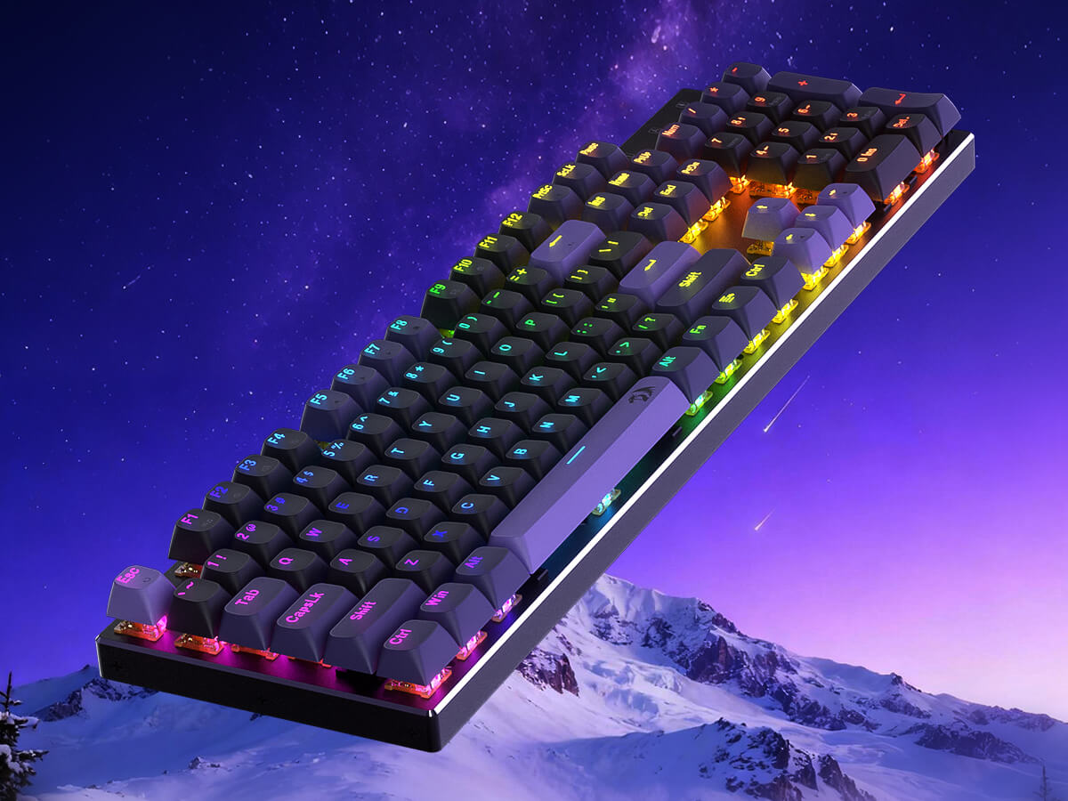 Redragon K556 Keyboard with RGB lighting on a snowy mountain background